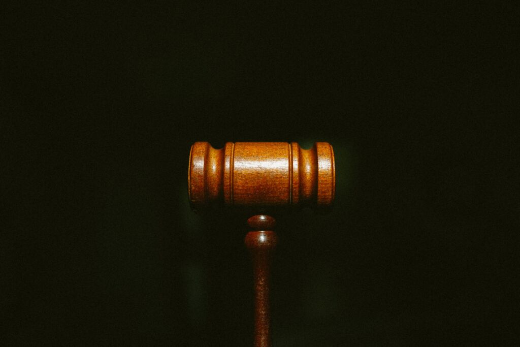 Bail bond gavel over a black background.